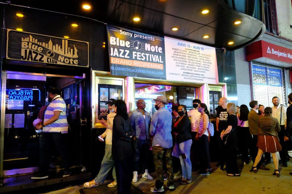 people standing outside of the venue