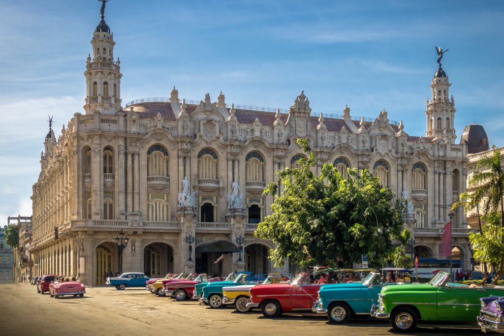 Classic convertibles parked outside the Gran Teatro de La Habana
